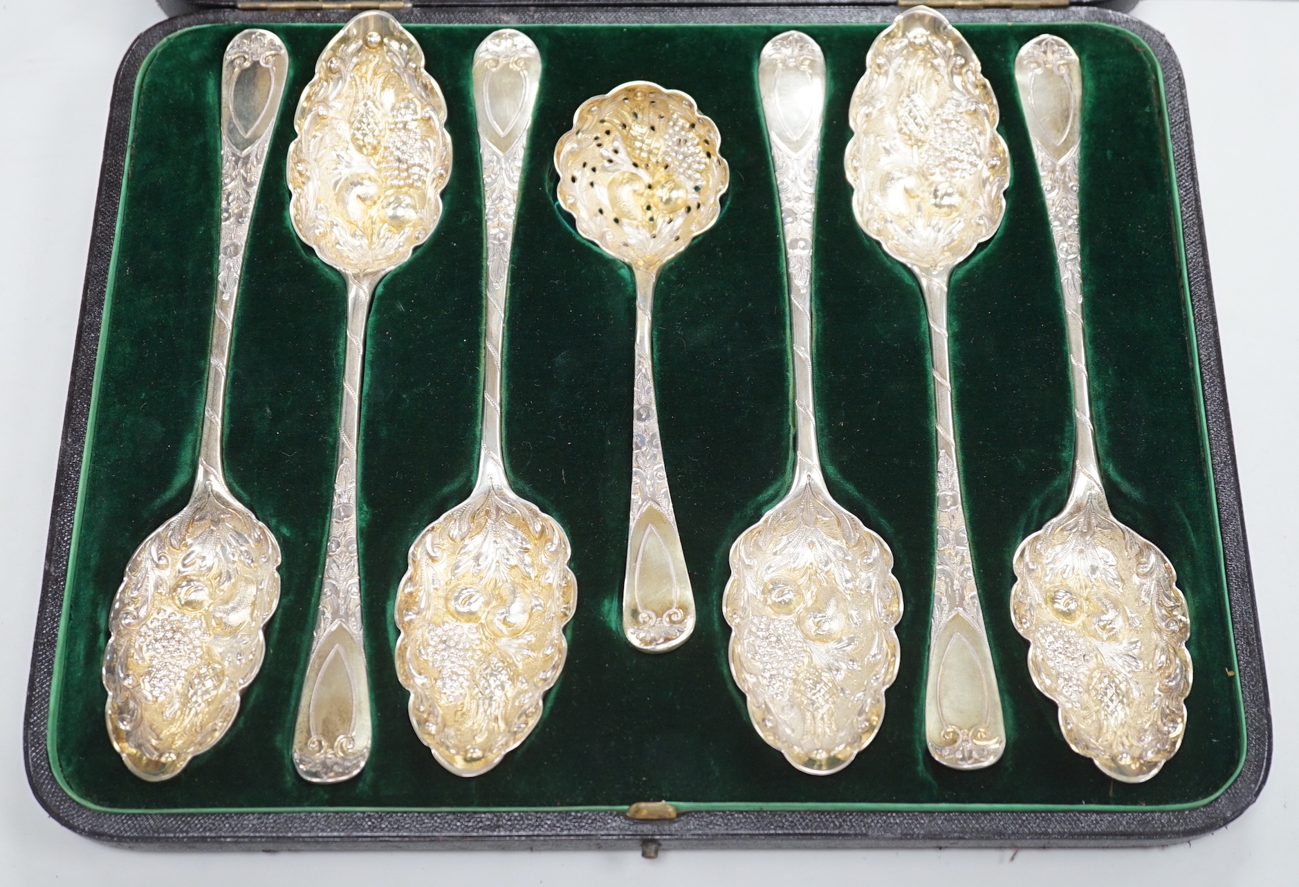 Three pairs of Georgian silver gilt Old English pattern berry spoons, 1782, 1805 and 1808 and a similar sifter spoon, 1798, in fitted case, 12.8oz.